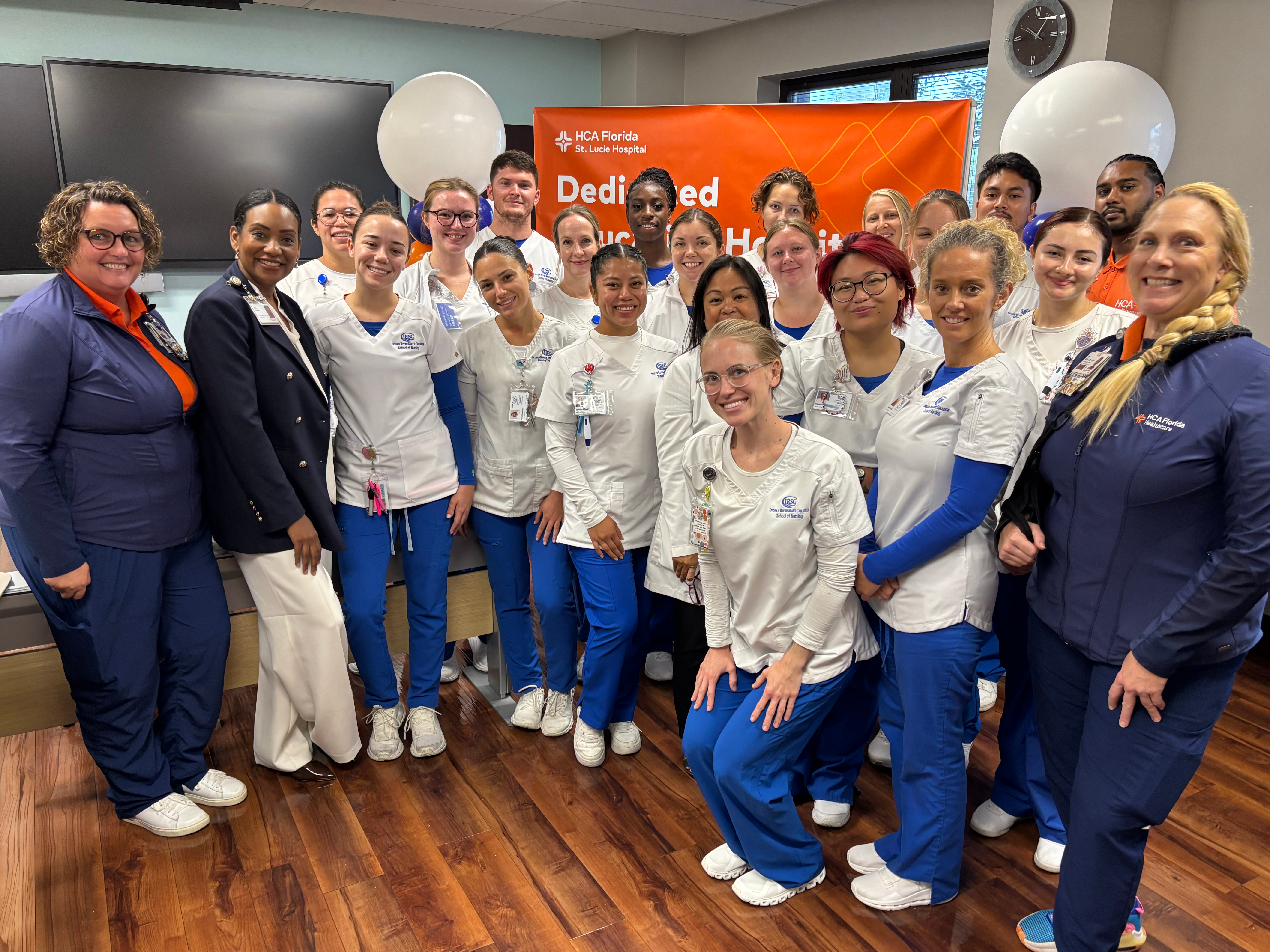 Large group of St. Lucie team members and students at dedication celebration.
