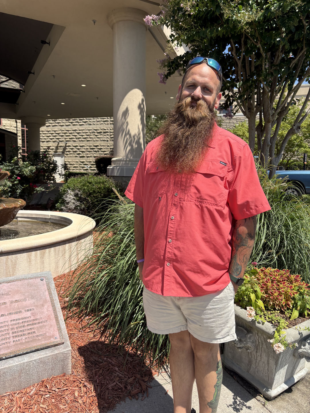 Man stands smiling after bariatric surgery.