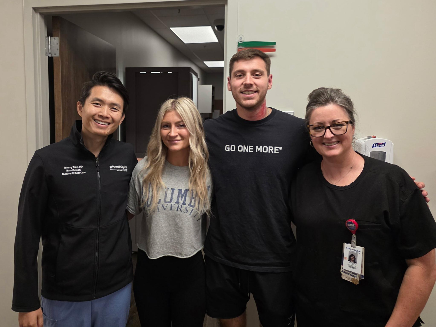 Malcolm during his care at TriStar Skyline; Malcom is pictured with Dr. Tommy Tran, his girlfriend, and Kristin, PA, in the trauma clinic.