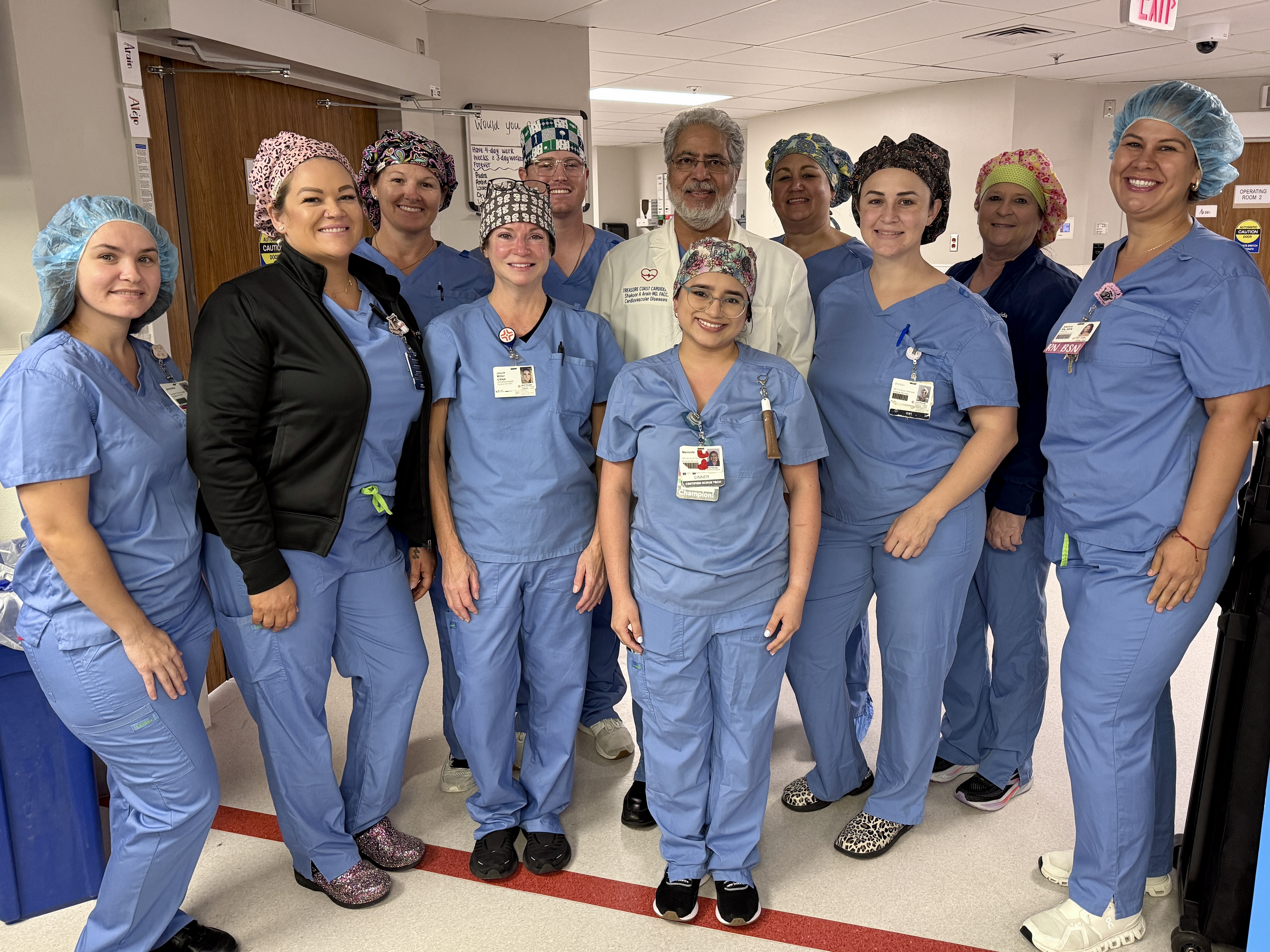Raulerson hospital hospital team in scrubs in hospital hallway.
