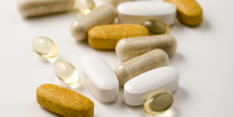 Various vitamins and supplements in capsule and tablet forms.