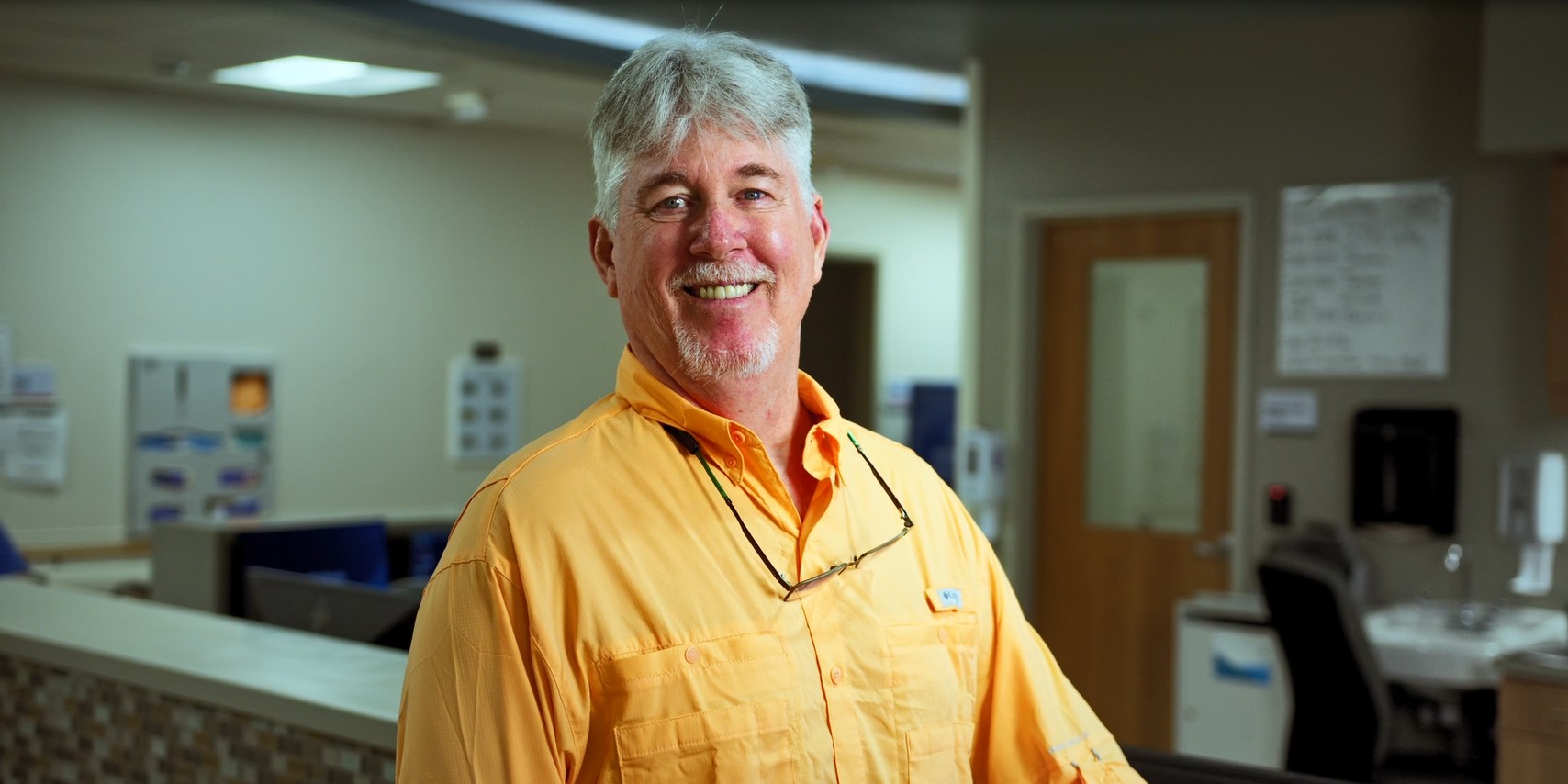 Mike Richardson in yellow polo headshot photo