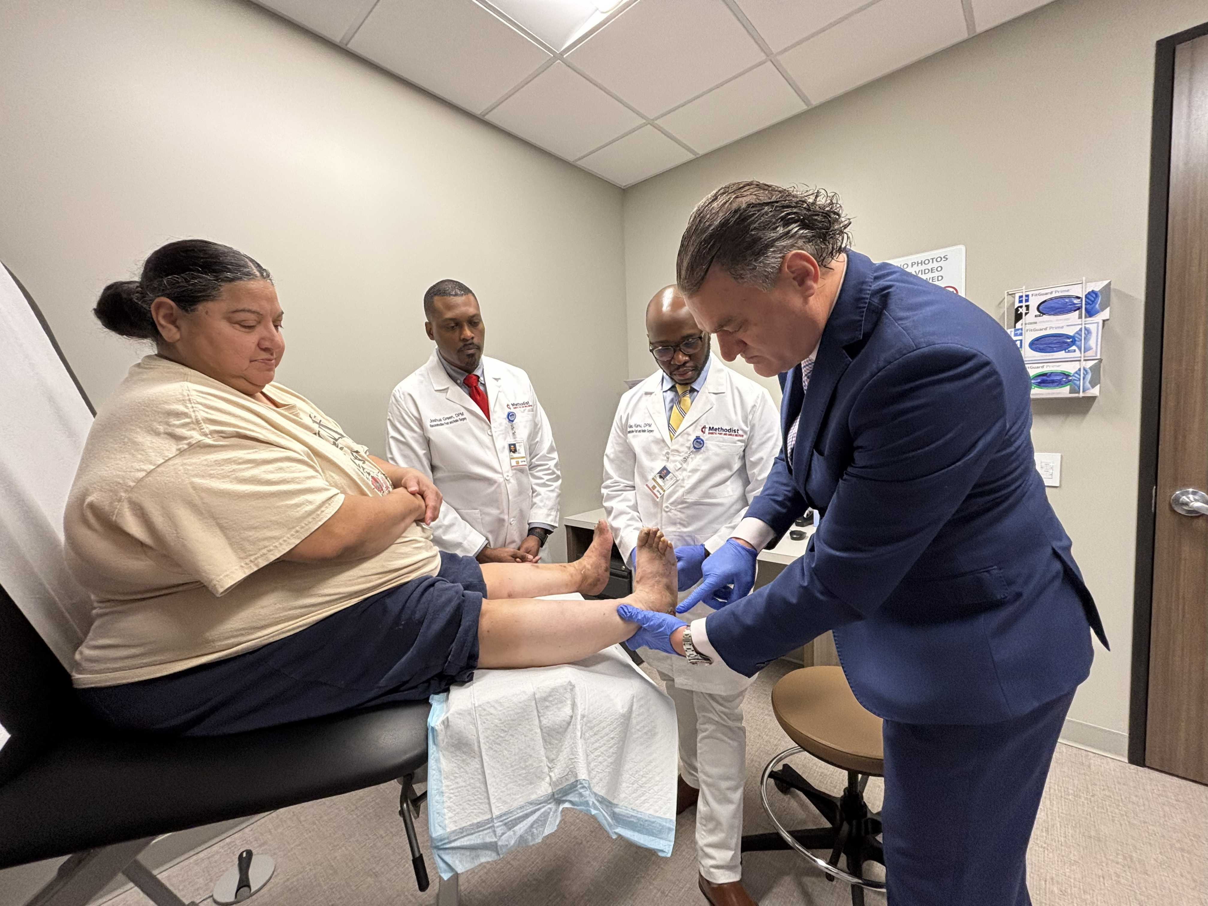 Dr. Thomas Zgonis, a podiatric surgeon at the Methodist Diabetic Foot and Ankle Institute, visits with a patient. 