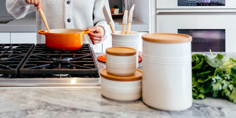 An assortment of kitchen containers and stovetop