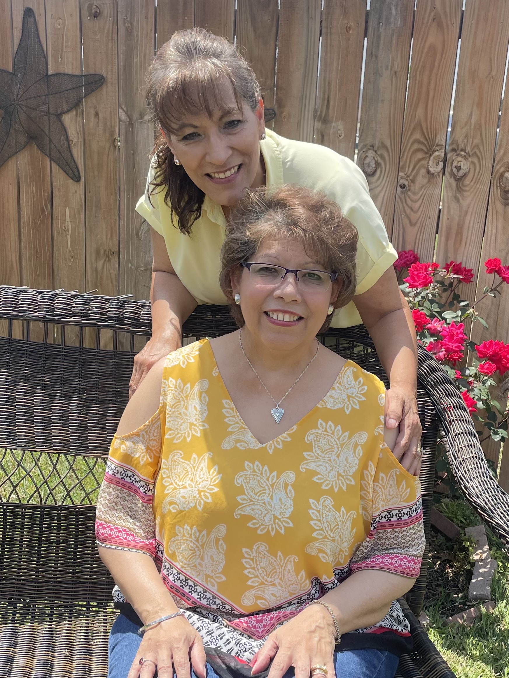Diane Sims and Margaret Kapchinsky sitting outside.
