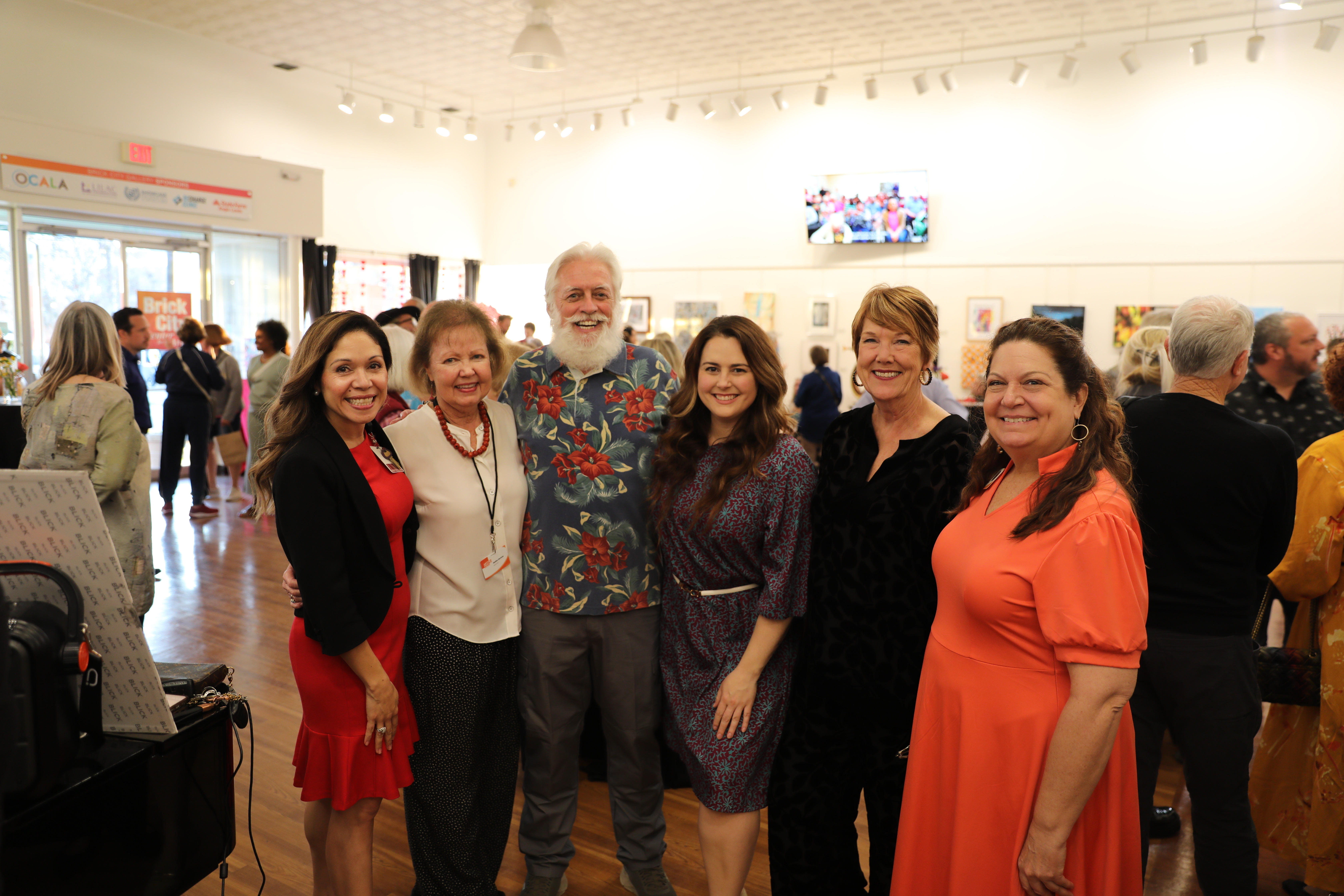 Group share a photo at the Arts and Health Exhibition.