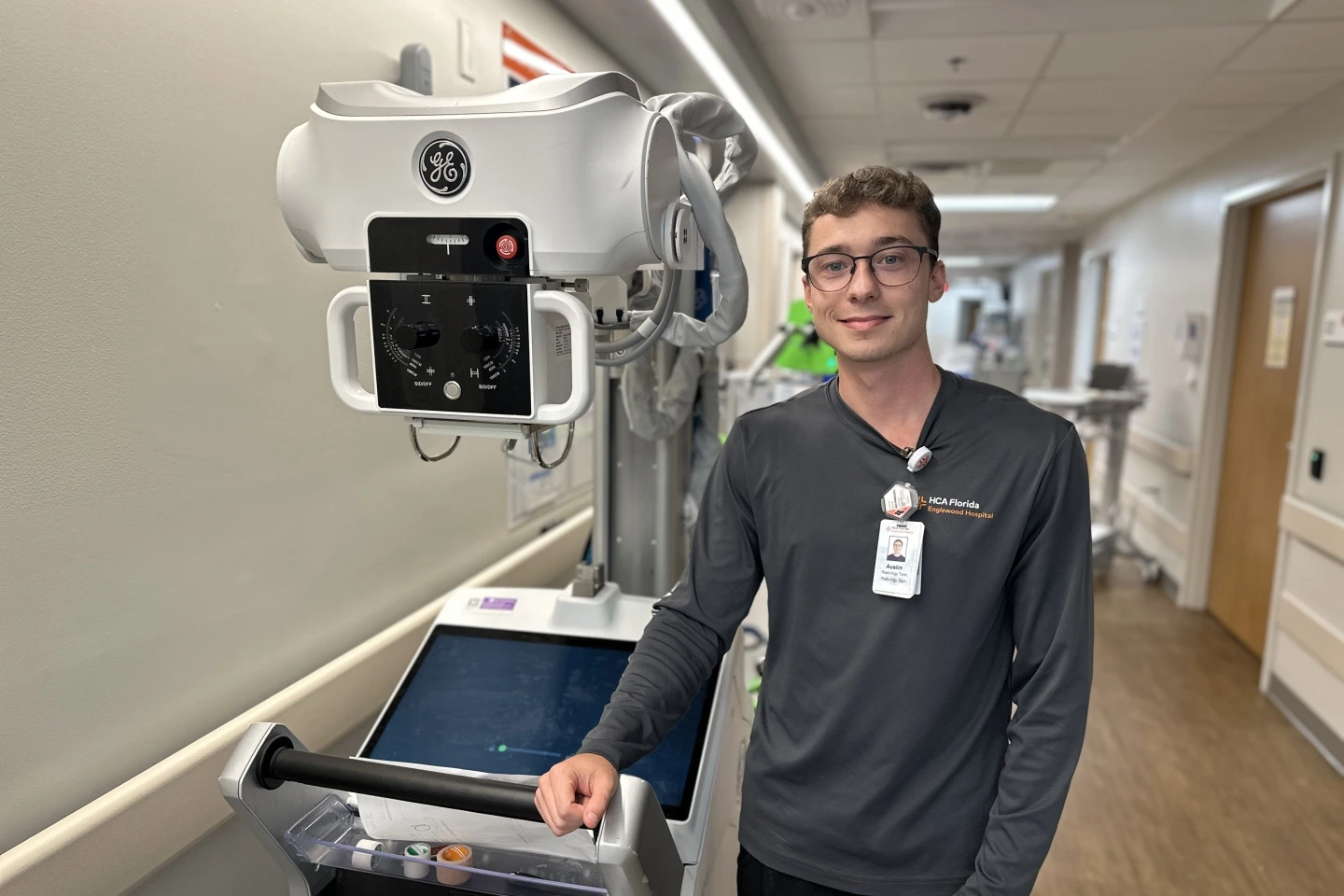 Radiology Technologist Austin Means prepares to take images of a patient in the Emergency Room with the portable x-ray.