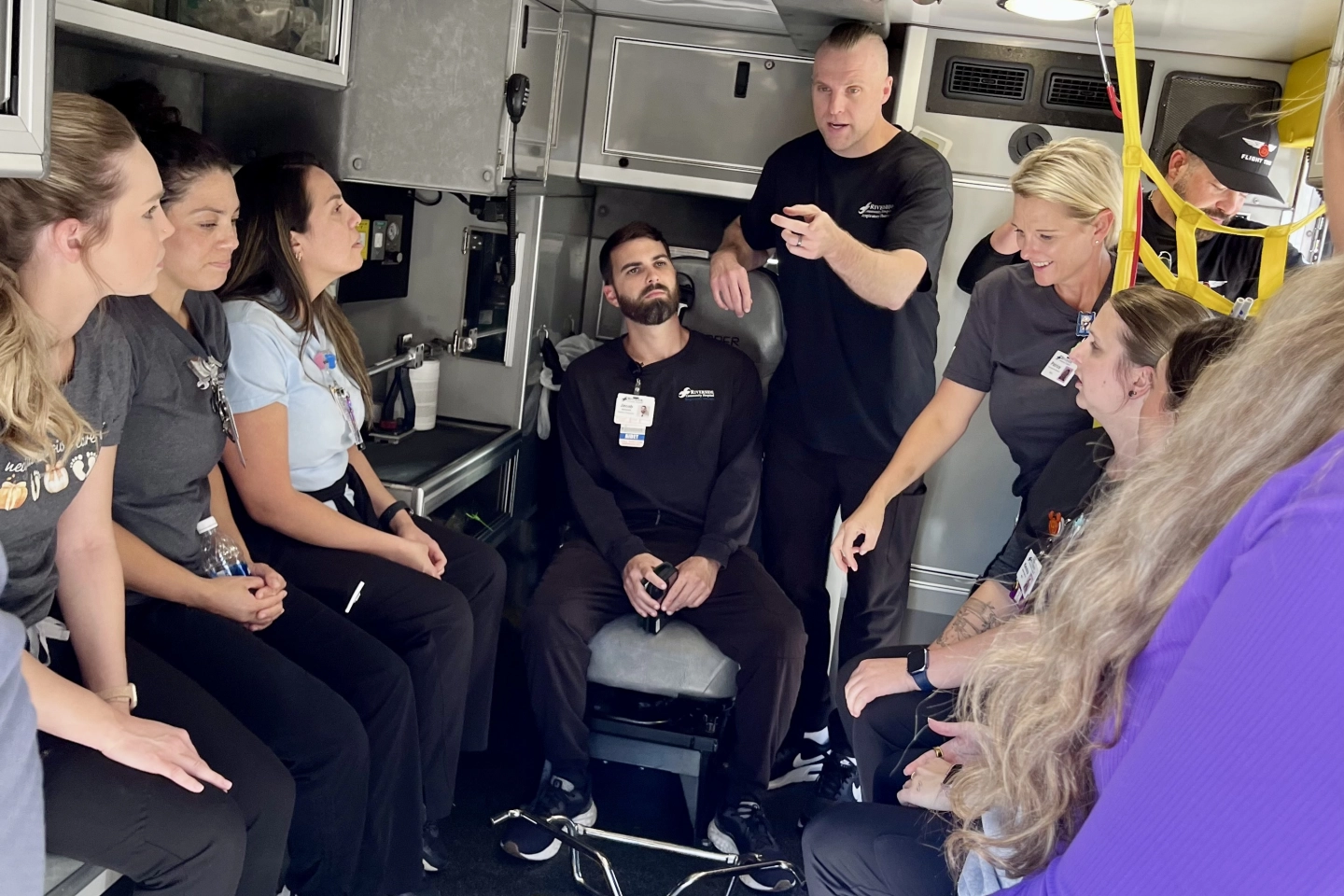 The transport team debriefs inside the special ambulance for infants.