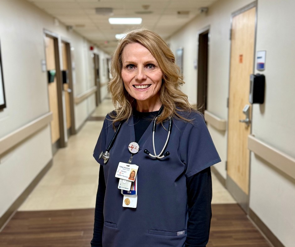 Carolyn poses inside the hospital for a photograph.