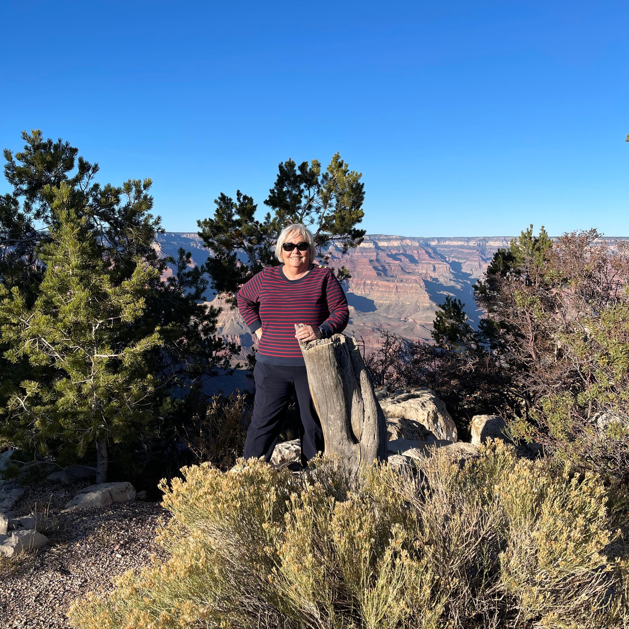 Jan Duggins poses with the Grand Canyon in the background.