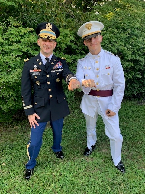 Col Kirkpatrick and his son Cadet Kirkpatrick proudly display their rings at the West Point ring ceremony.