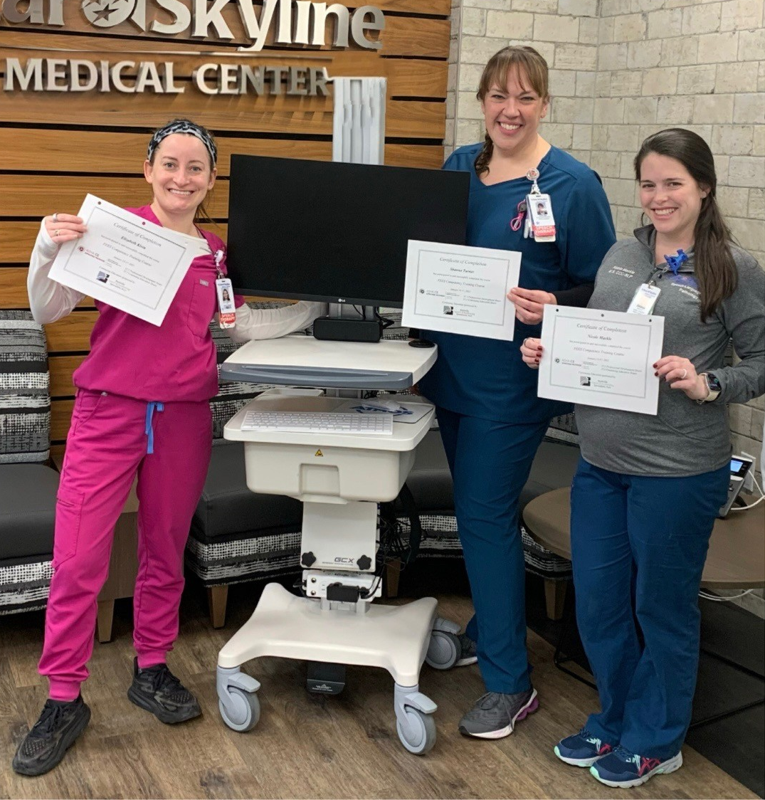 Speech language pathology team showing off their certificates.