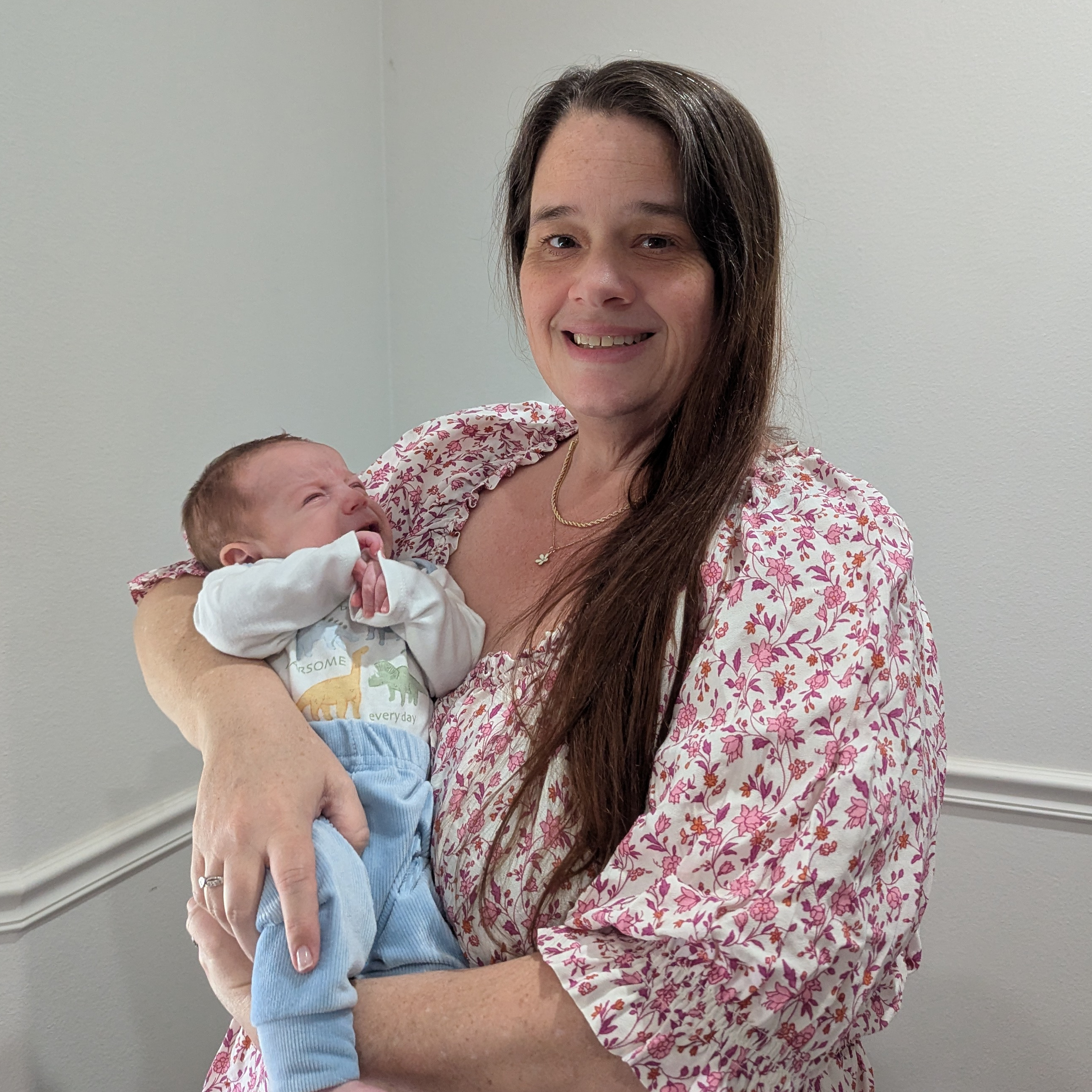 Lanna and baby August posing for a picture.