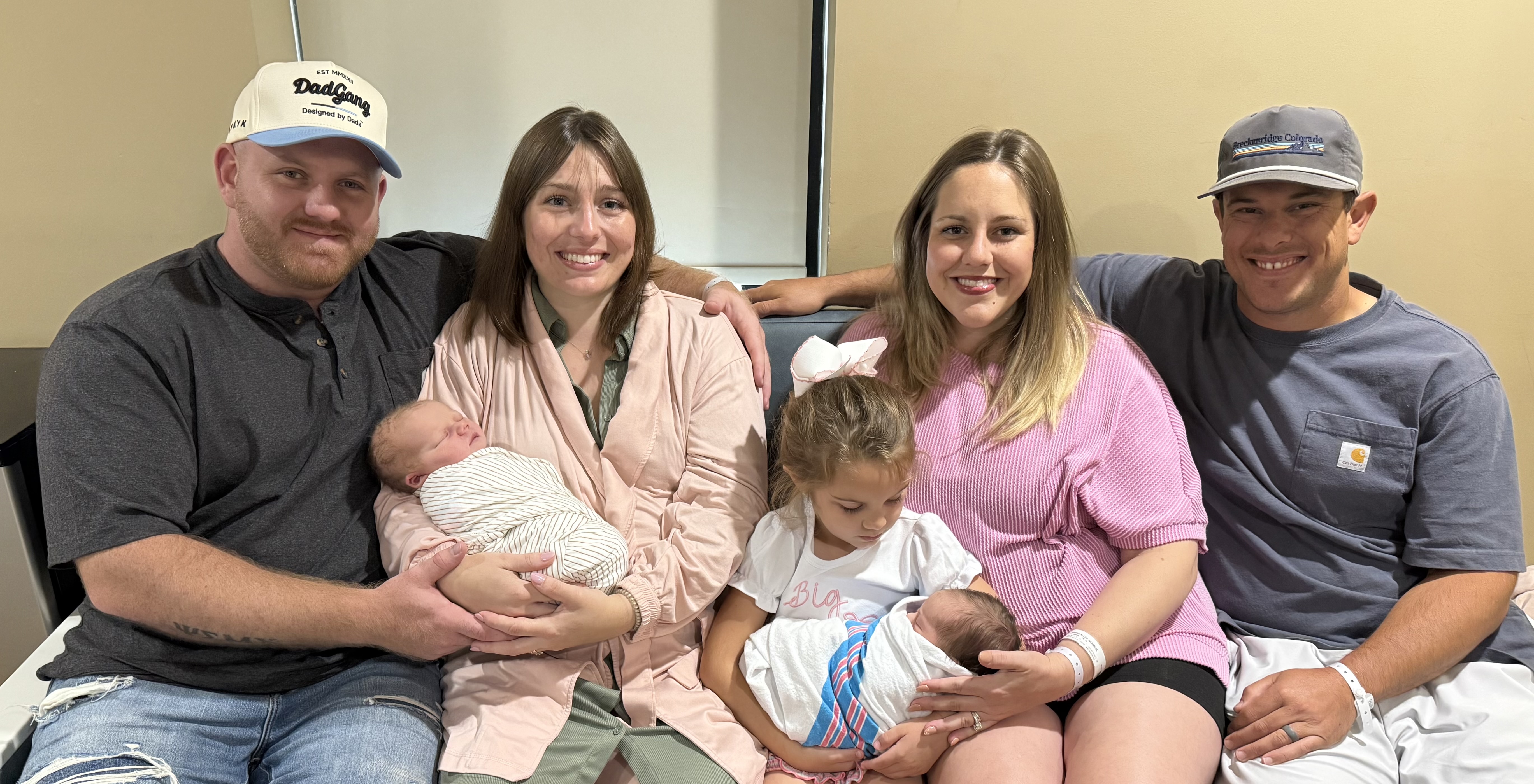 Sisters Katey and Alley, their husbands, children, and newborn babies.