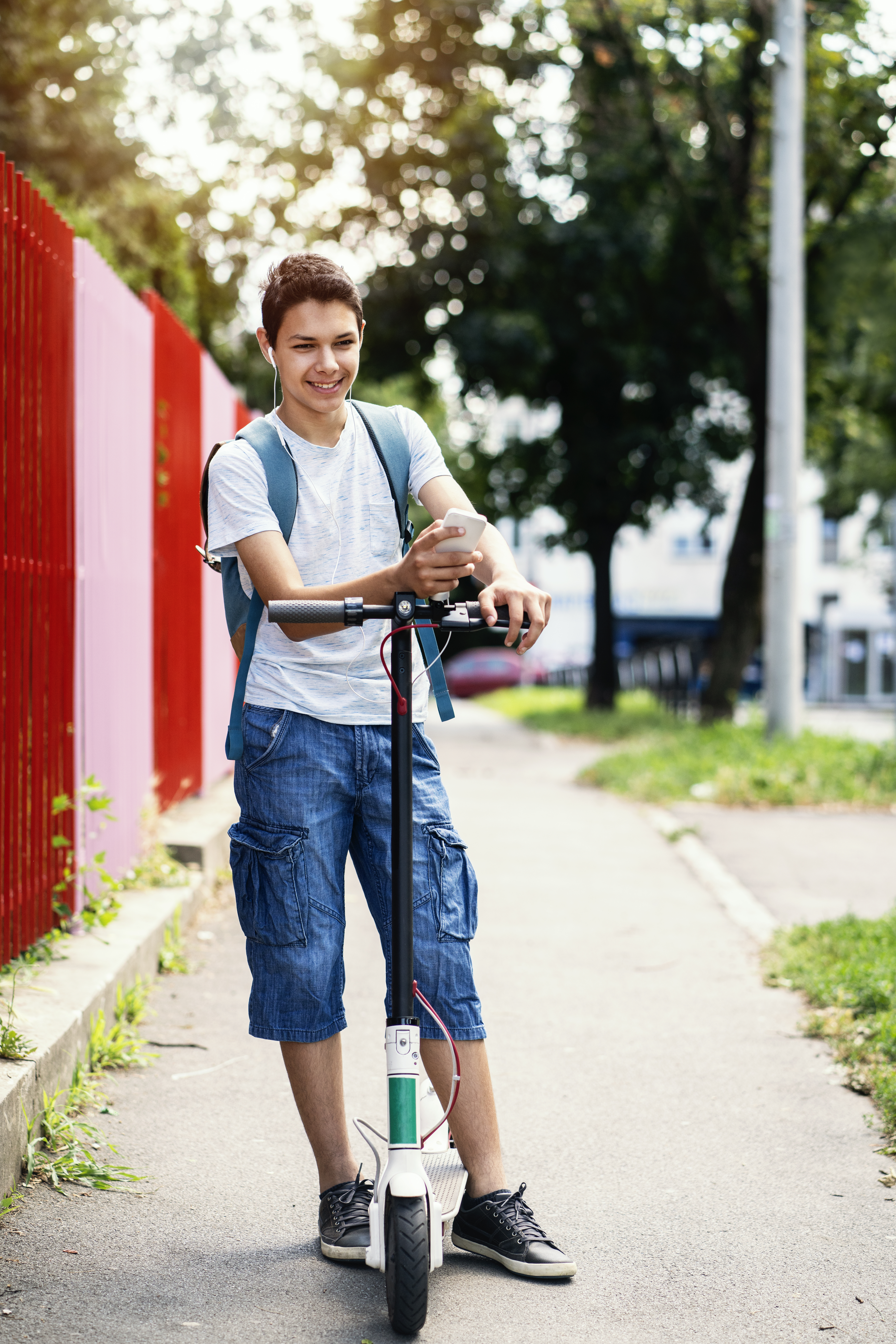 Teenager on E-scooter.