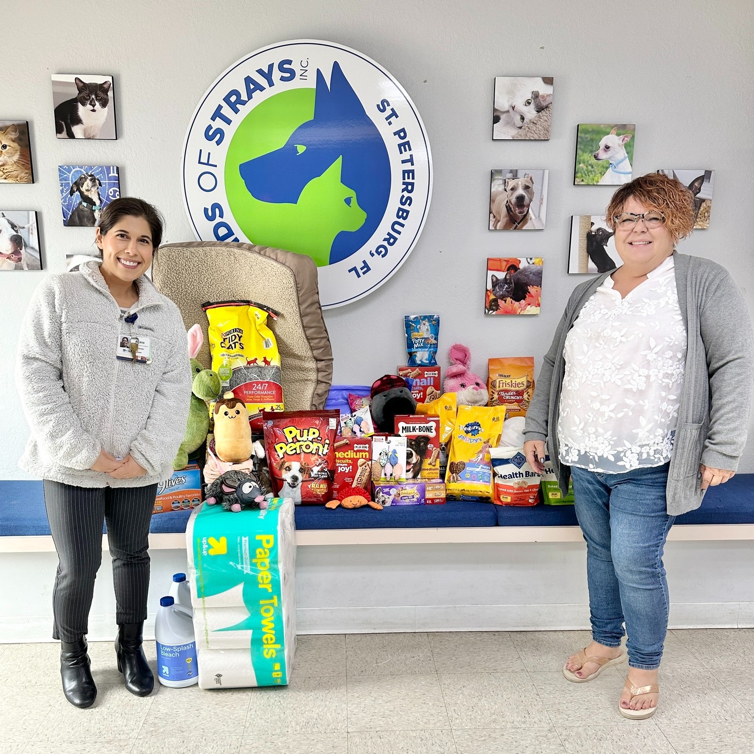Two females from Friends and Strays receiving the Give Back to Shelter Animal Through Santa Paws Pet Supply Drive. 