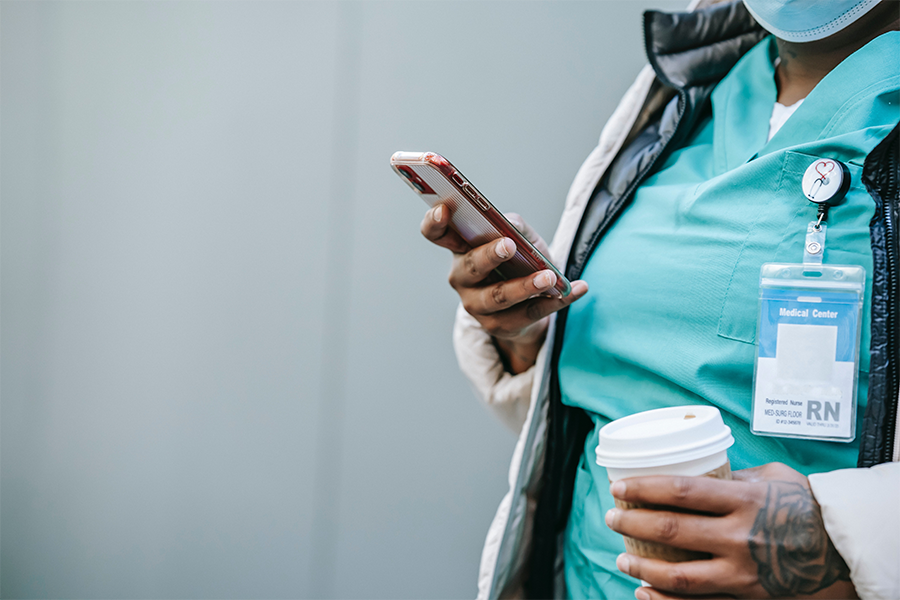 A doctor looking at their phone.