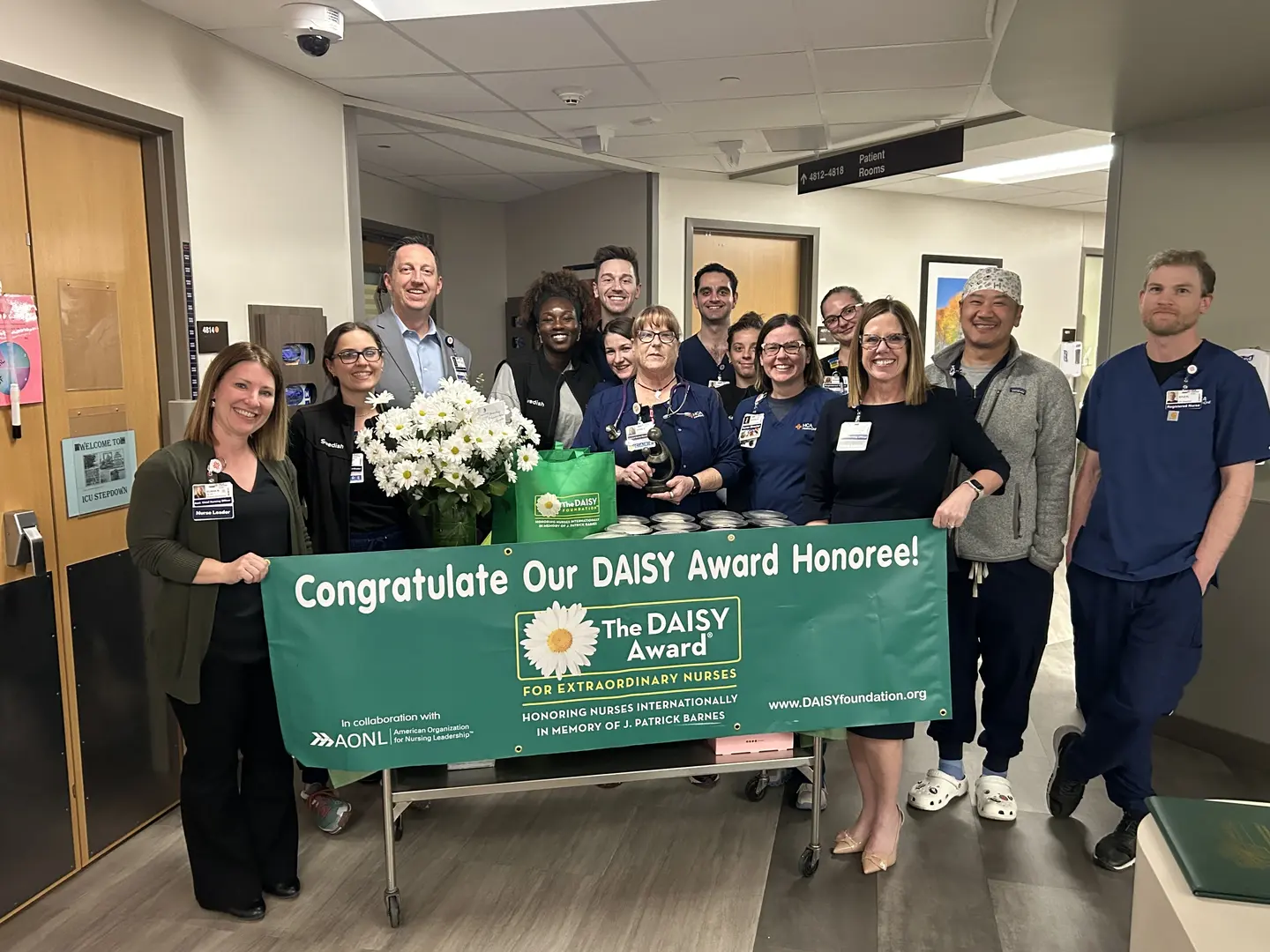 Denise Gray and her team celebrate her reception of the DAISY award.