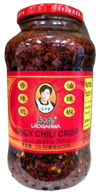a jar of lao gan ma spicy chili crisp on a white background