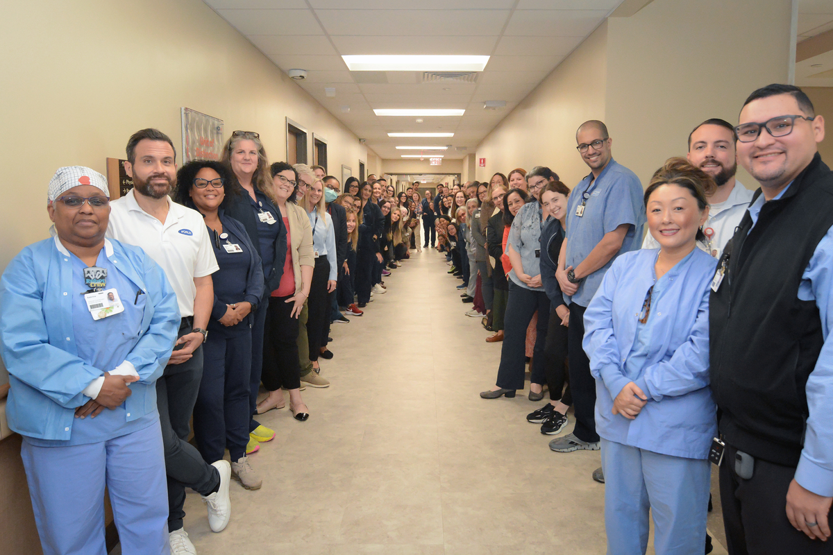 Colleagues of Oviedo Medical Center lined the walls of the hospital's newly opened fourth floor.