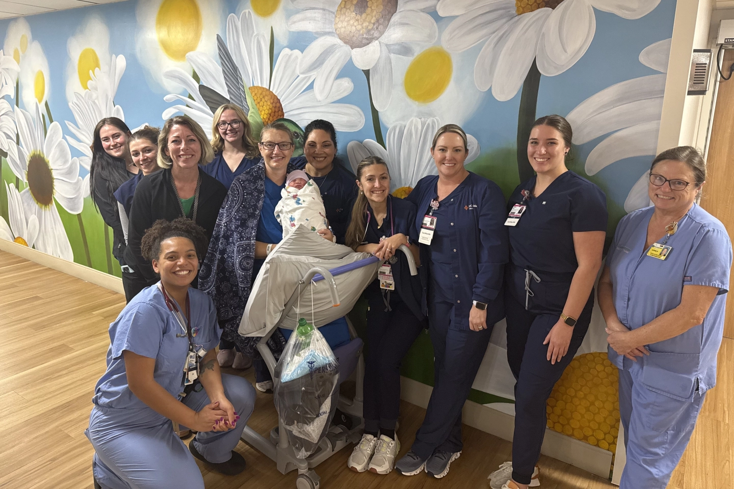 New mom, Stephanie, baby Corbin and the labor and delivery team gather for a photo.