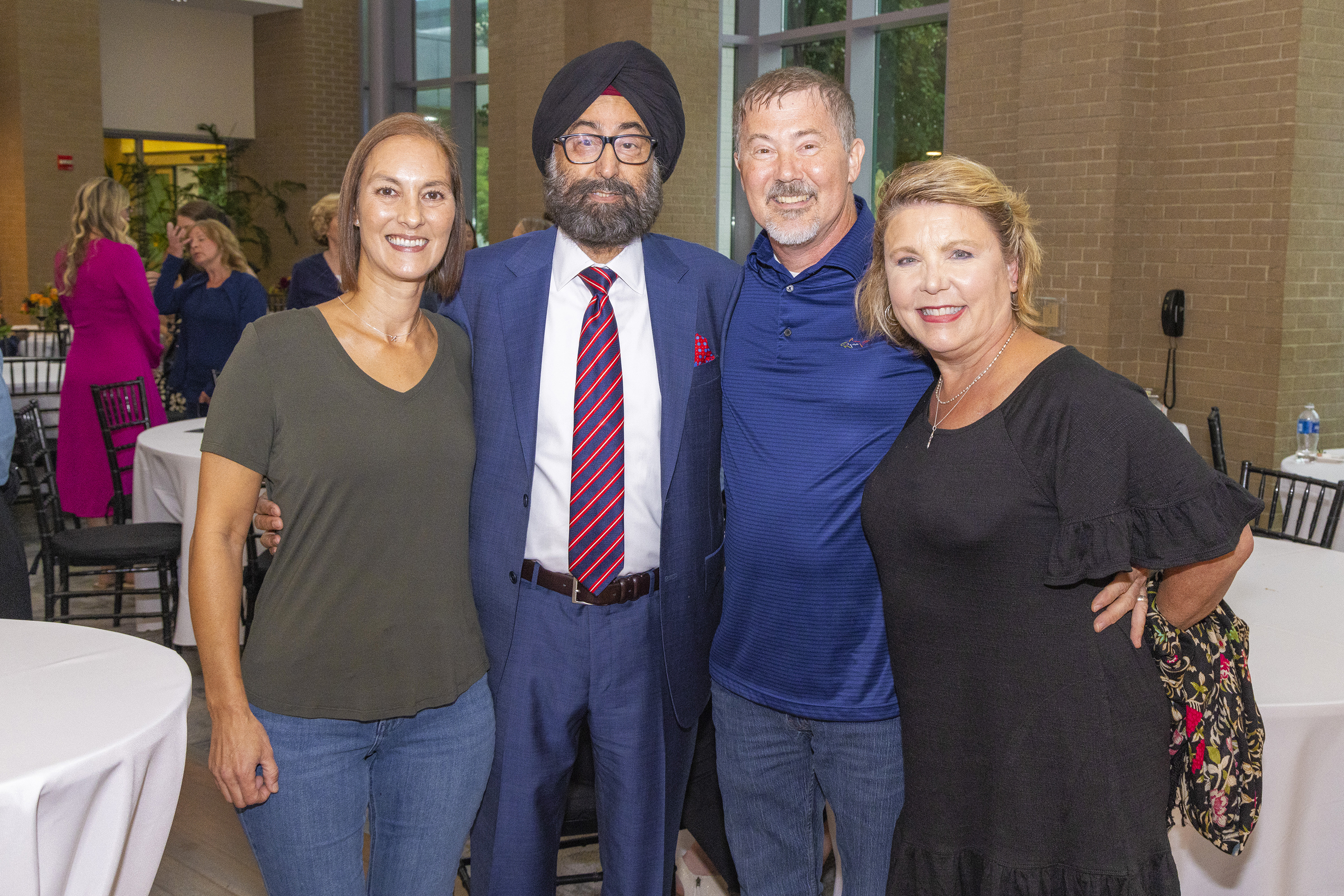 Jacquelyn Stevens posing with three other people.
