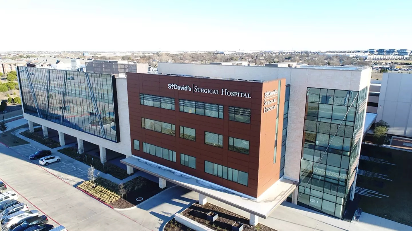 Exterior of St. David's Surgical Hospital on a sunny day.