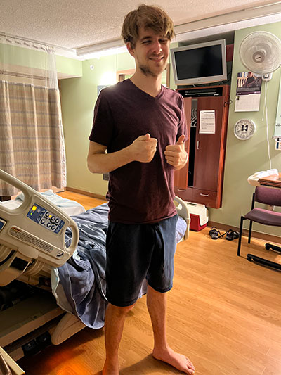 Noah Weaver smiles and gives two thumbs up.