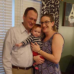 Kelley and Brian Schotte holding baby Amelia.
