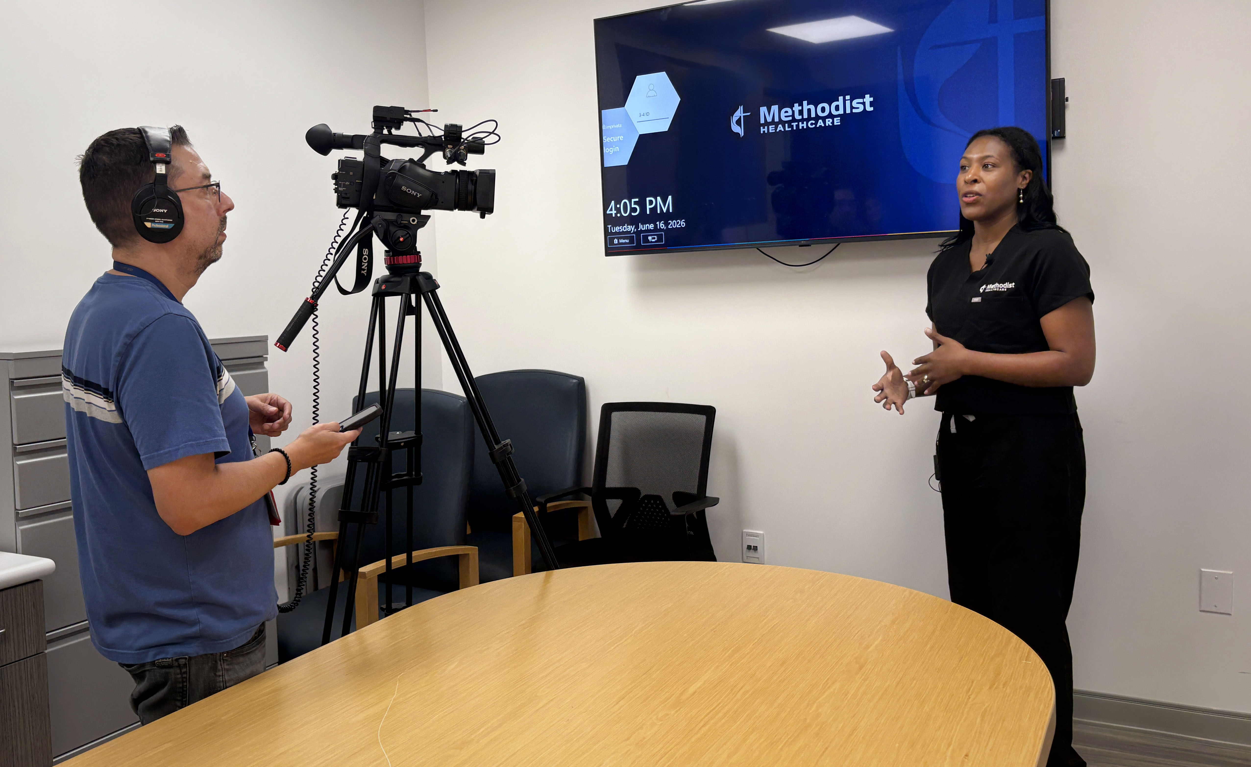 Dr. Carol Nwelue, chief medical officer at Methodist Hospital Texsan, is interviewed on camera for a KSAT segment about heat safety.