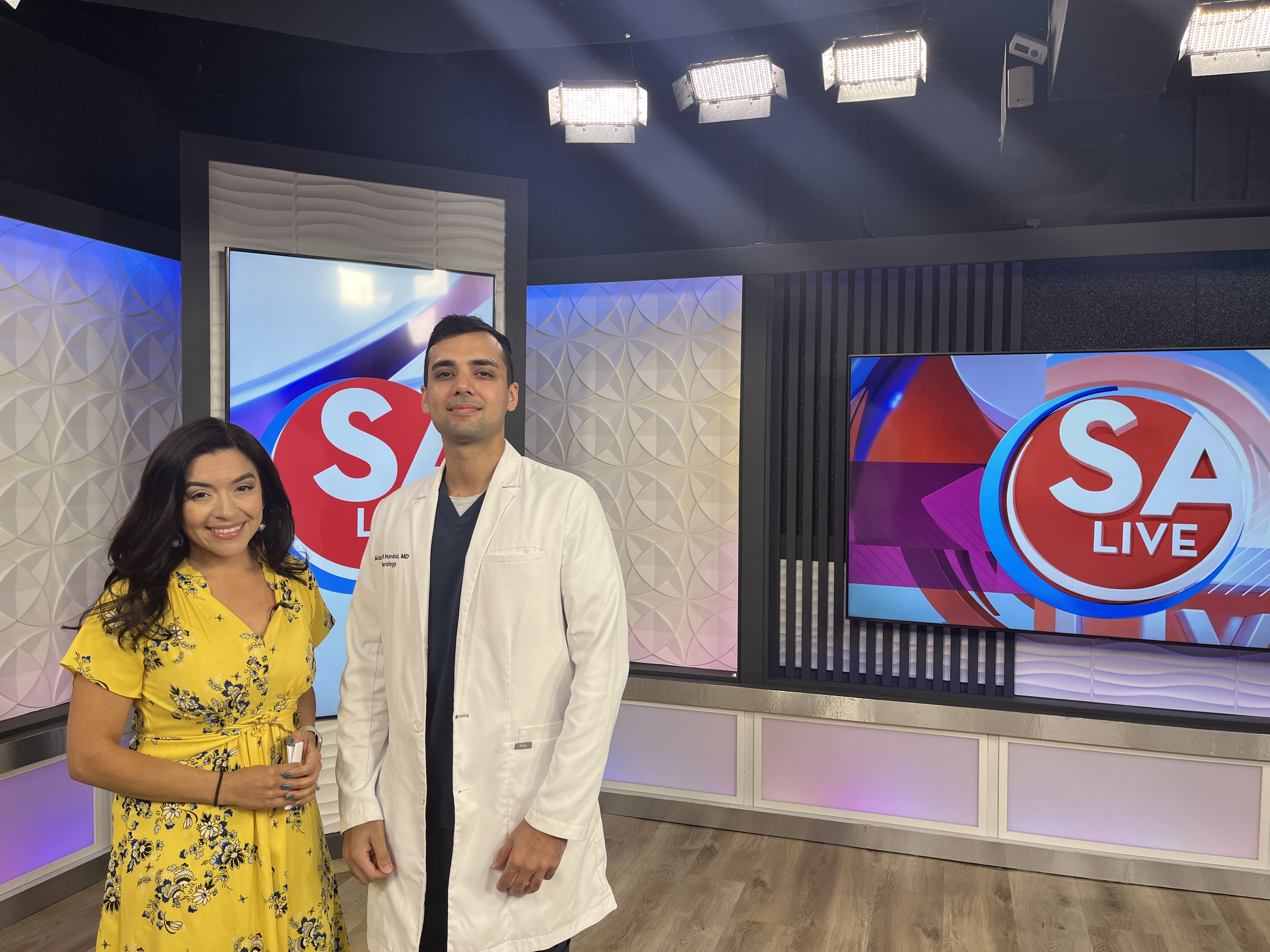 Dr. Hundal poses with KSAT SA Live anchor.
