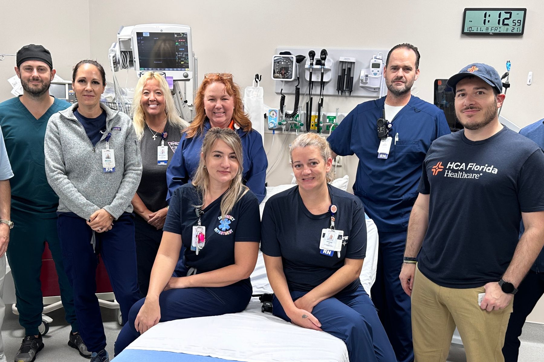 HCA Florida Englewood Hospital staff members pose for photo in in medical suite. 