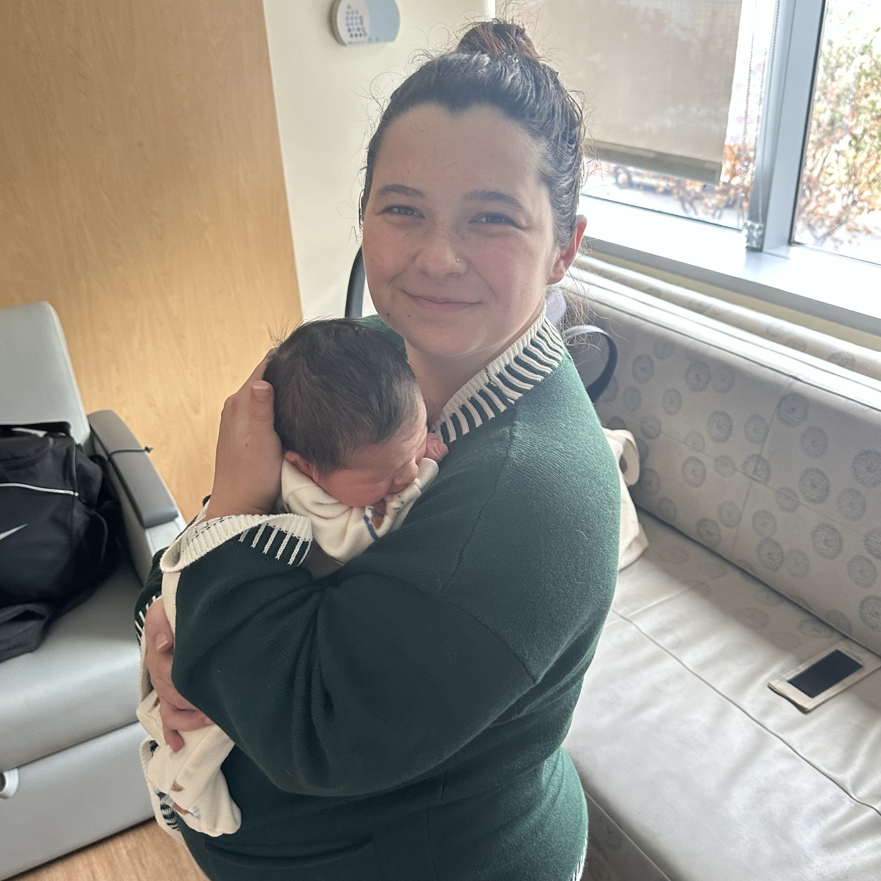 Photo showing Hannah Carmony, a patient from Methodist Hospital Stone Oak holding her newborn baby.