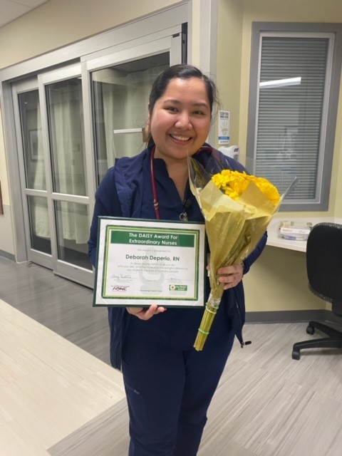 Deborah Deperio receives award.