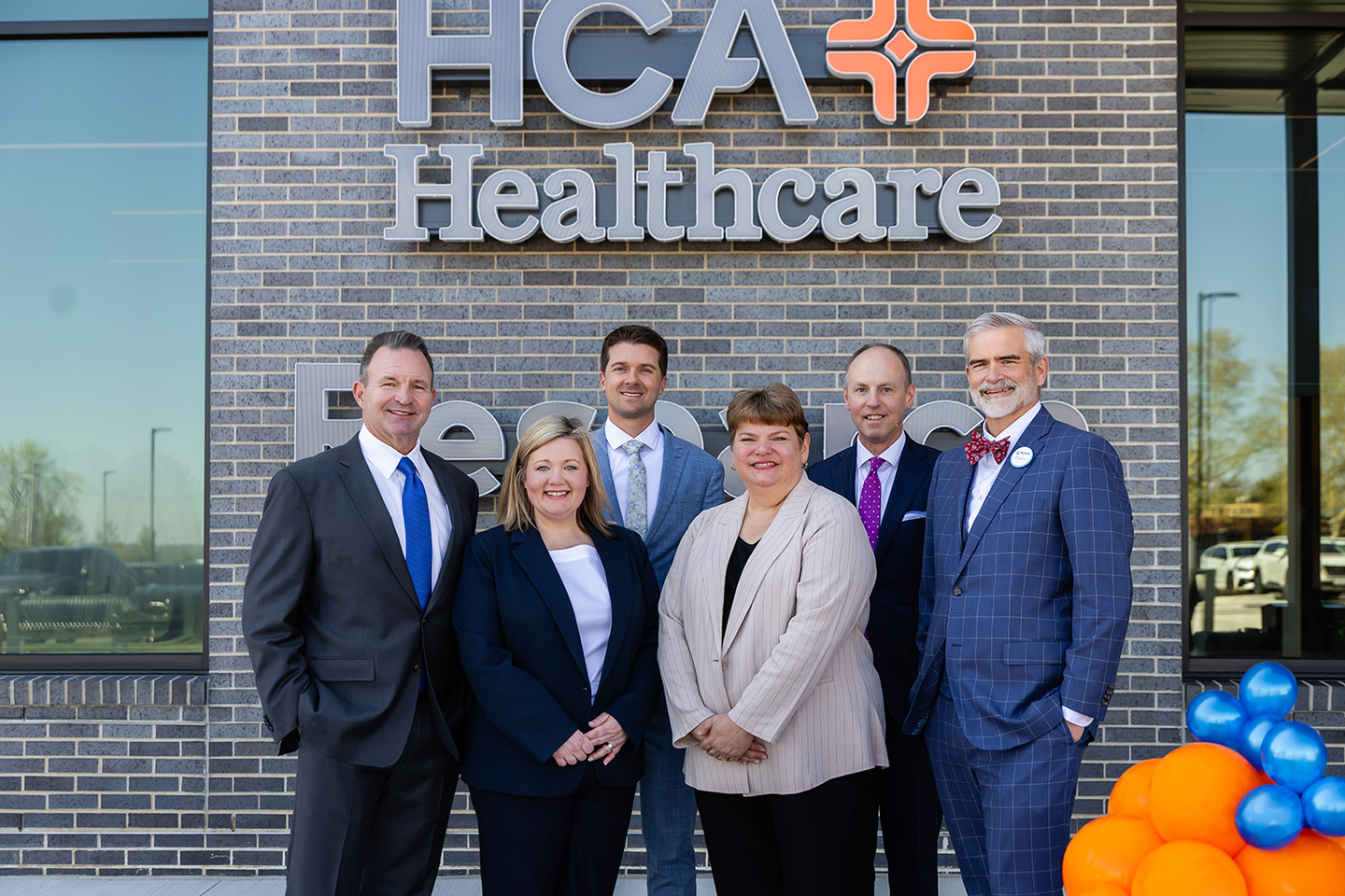 HCA division hospital and college leadership at ribbon cutting ceremony.