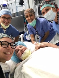 Stacy Ciaschini prepped and ready for surgery, with her nurse colleagues surrounding her.