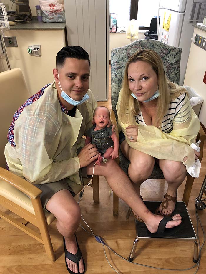 Angela and her husband, Anthony, with their new son, Konner