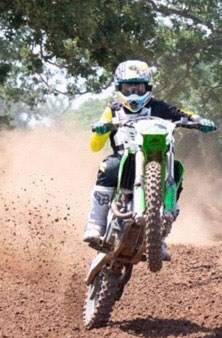 Terry Chaffee doing a wheelie on a dirtbike.