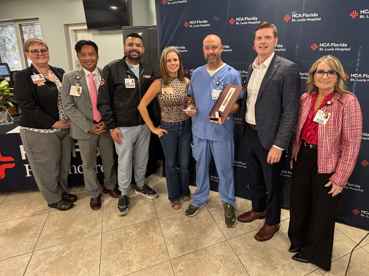 Dr. Jon Brown and his fiancee, with hospital leadership.