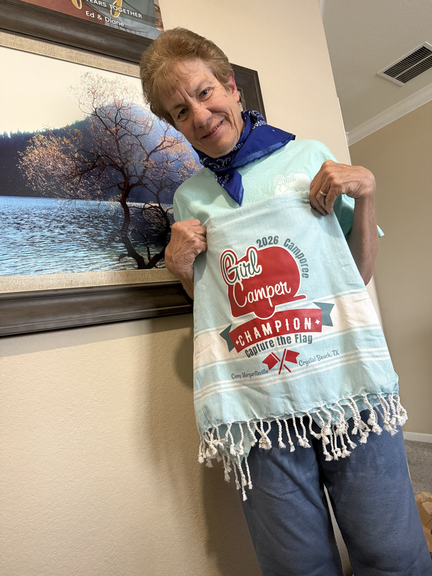 Diane holding the Capture the flag champion towel.