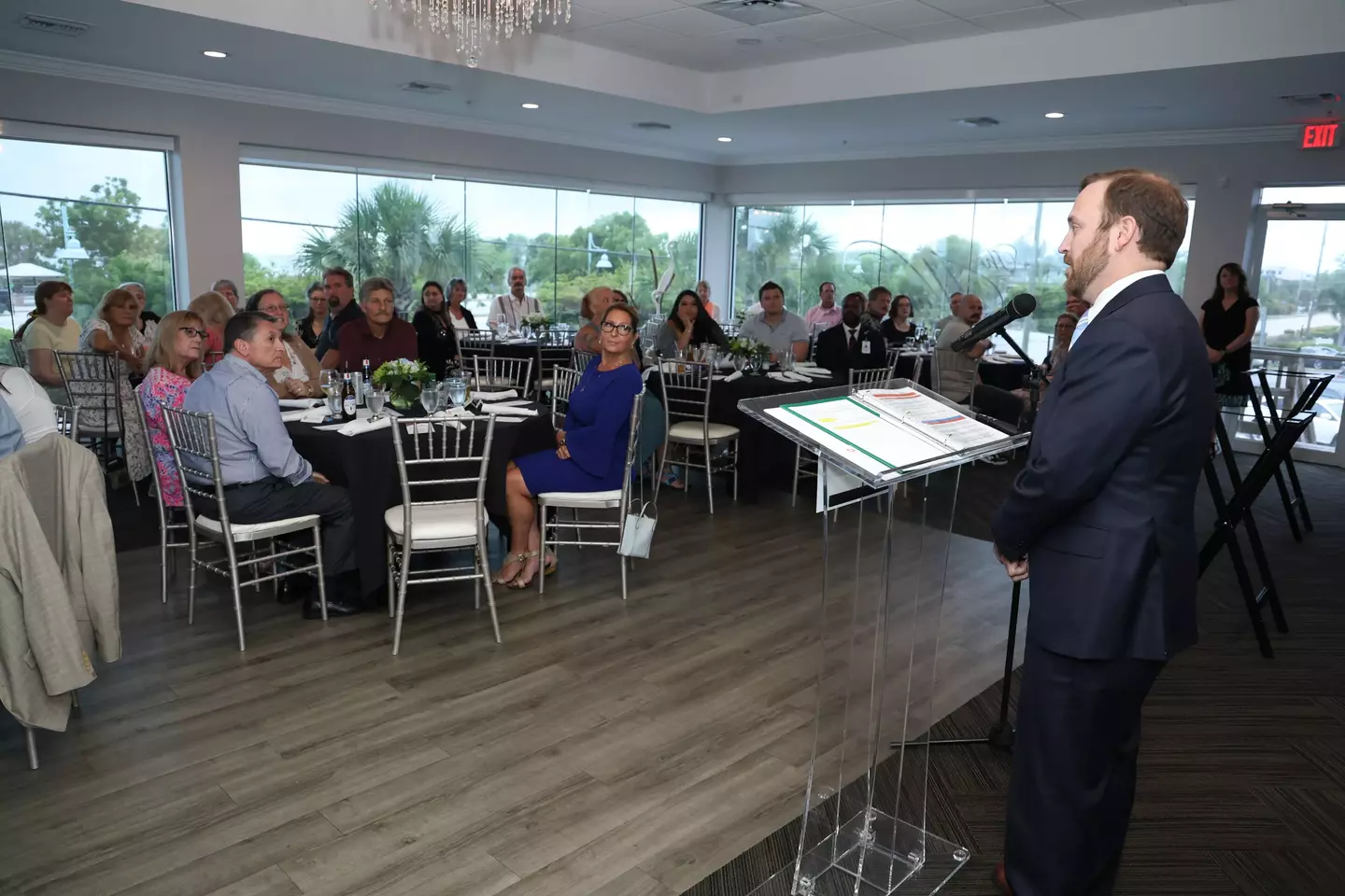 CEO Joe Rudisill speaks at podium at Awards of Distinction event