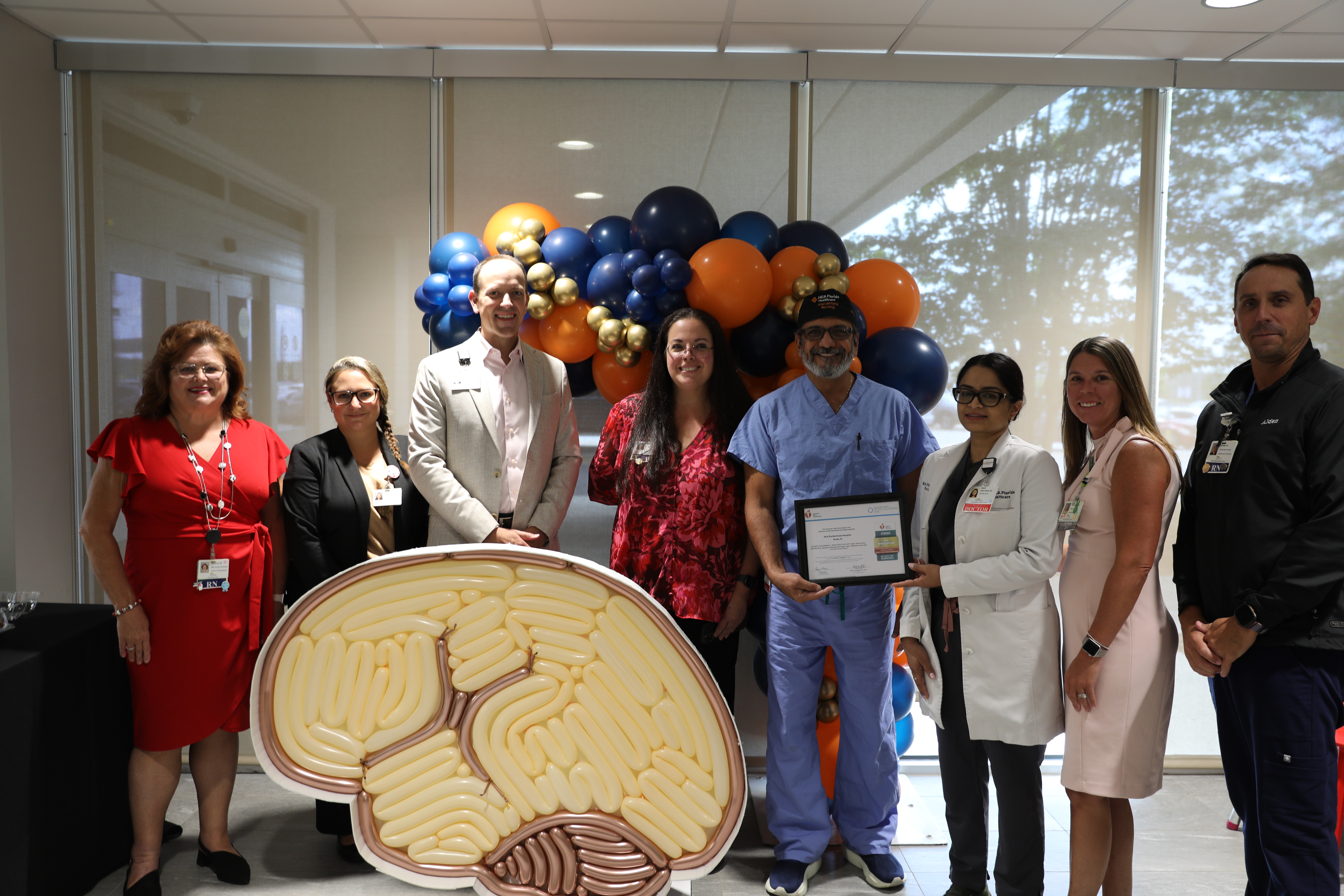 HCA Florida team members at award celebration in hospital.
