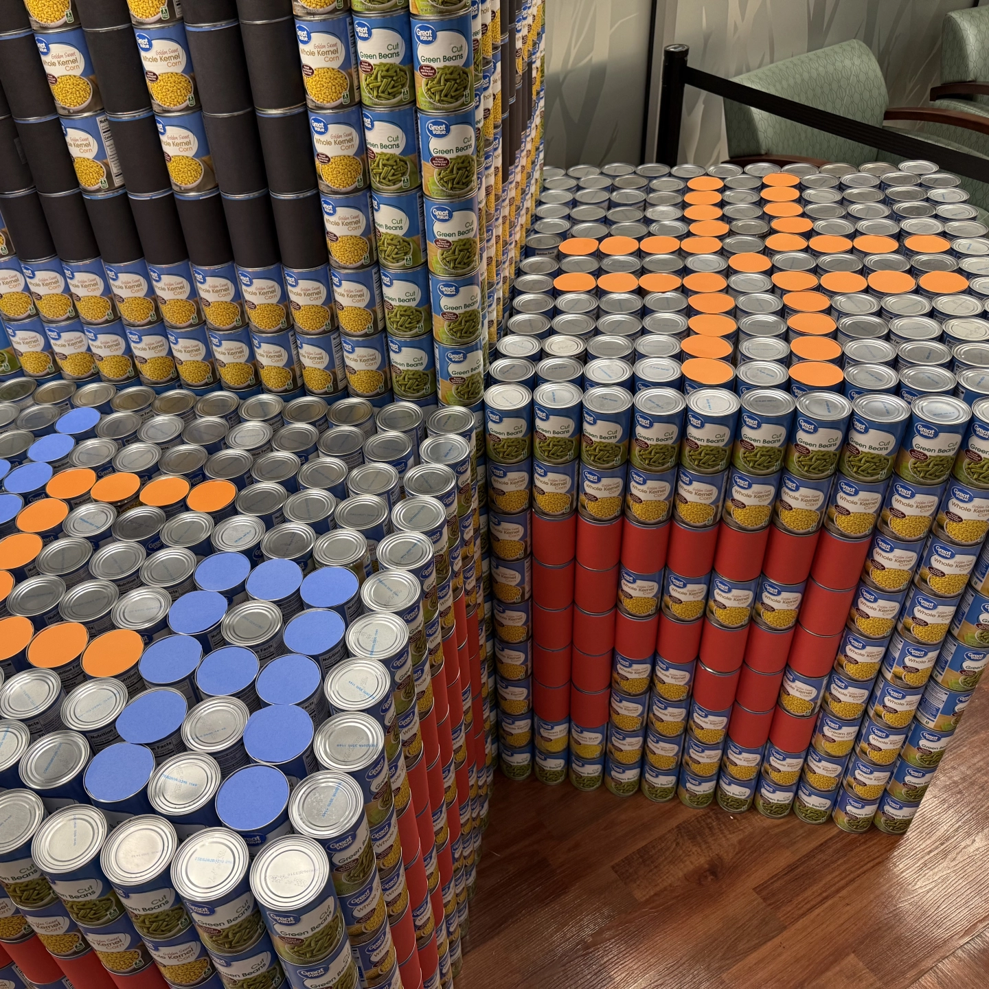 Large blocks of canned foods with We Care branding.