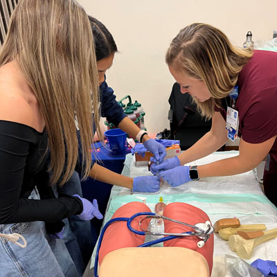 Local high school students engage with medical professionals at the Health Career Expo hosted by Portsmouth Regional Hospital.