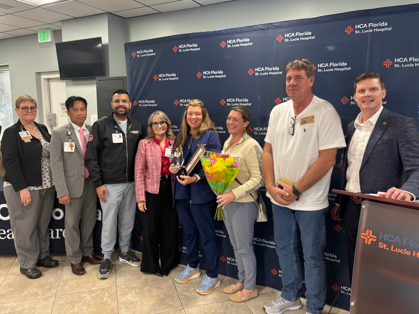 Mellissa Spinner with her family and hospital leadership.