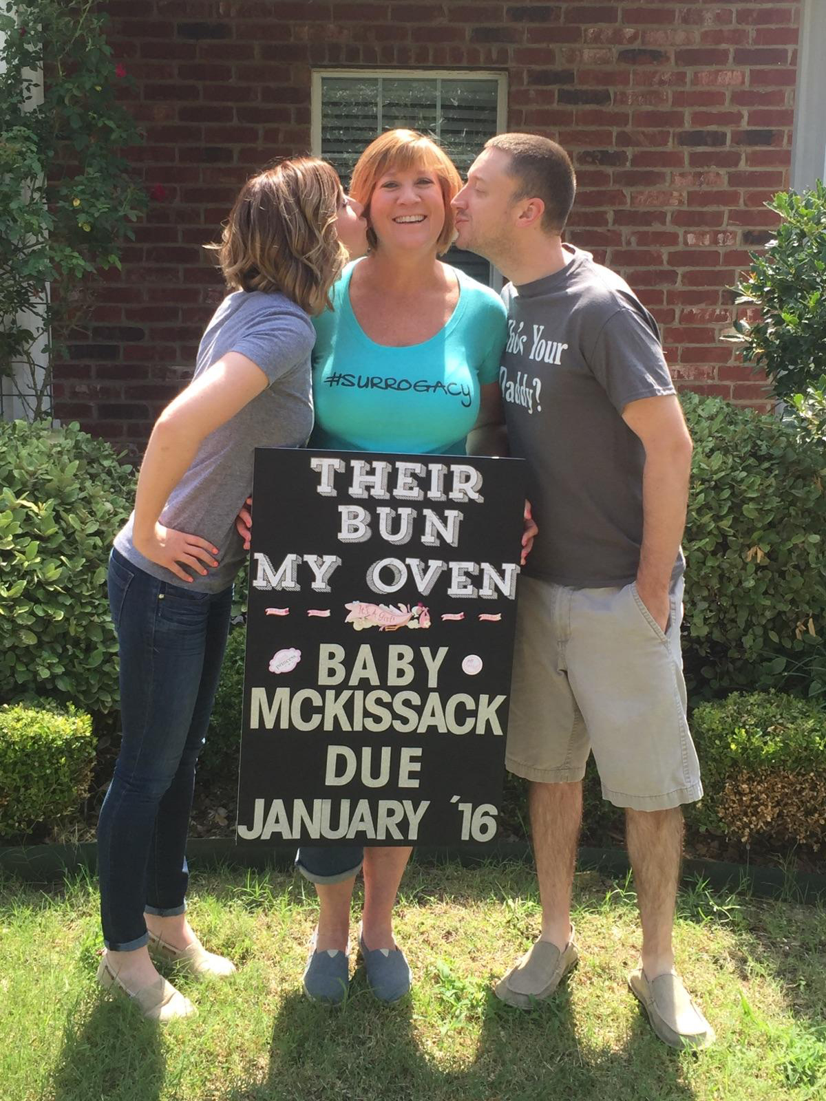 Tracey Thompson announces baby McKissack is due January 2016, as Kelley and Aaron McKissack each give her a kiss on the cheek.