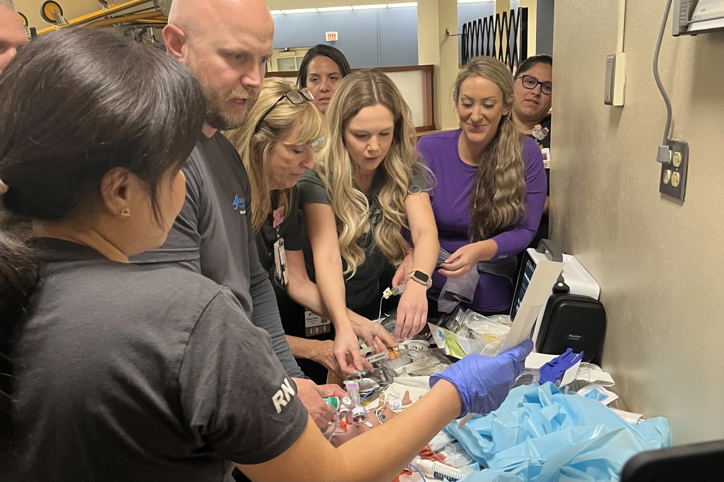NICU nurses and Respiratory Therapists doing hands-on simulation learning.