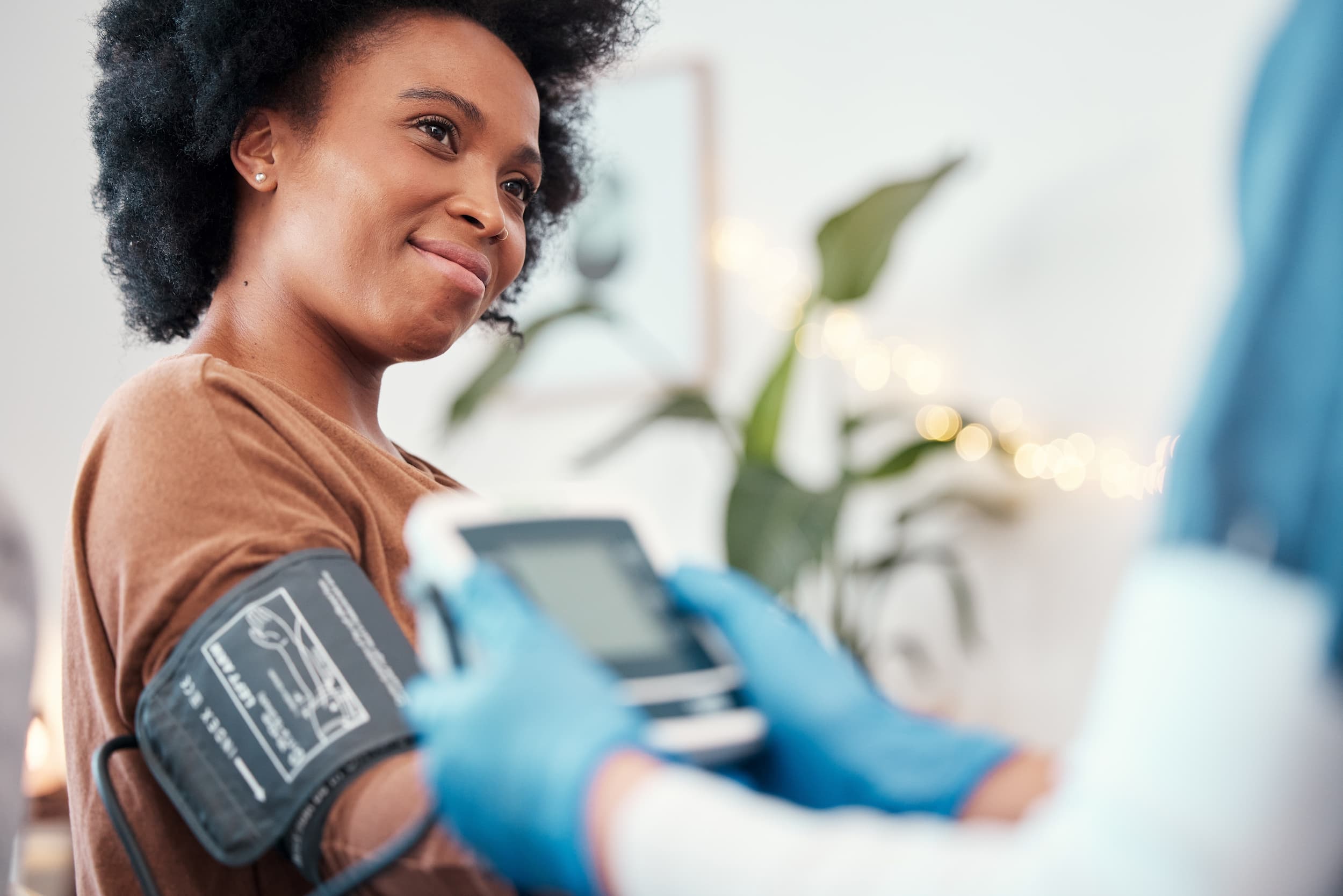 A woman getting her blood pressure checked