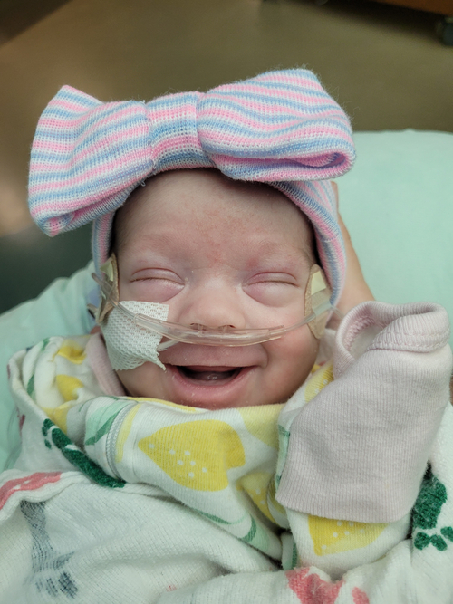 NICU baby smiling