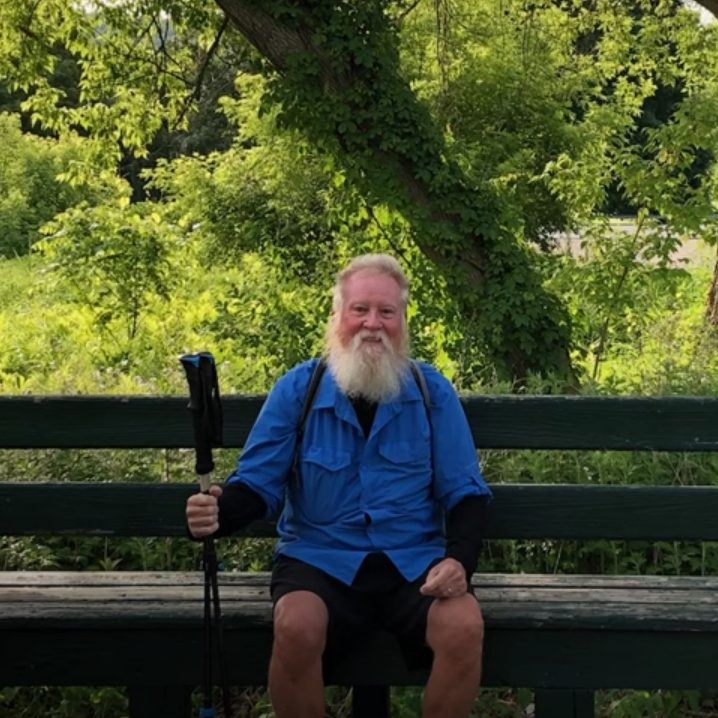 Tom Richardson taking a break on a bench along the Appelachian Trail.